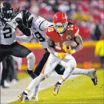  ?? Jeff Roberson
The Associated Press ?? Running back Isiah Pacheco, trying to avoid the Jaguars’ Rayshawn Jenkins (2) and Arden Key last week, gained 95 yards in the Chiefs’ 27-20 victory.