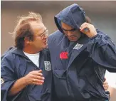  ??  ?? Then NSW State of Origin coach Tommy Raudonikis speaks with player Ken McGuinness during training in 1998.