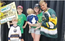  ?? FACEBOOK ?? Rance Cardinal poses with Allyce Olfert and her children after his arrival in Humboldt on Sunday. Cardinal walked from Ontario as a way to honour those affected by the Humboldt Broncos bus crash in April.