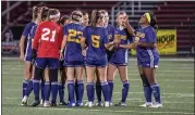  ?? BARRY BOOHER — FOR THE NEWS-HERALD ?? Kirtland’s Aria Evans-Roskos rallies her side in a prematch huddle prior to a 3-0 Division III regional semifinal win Nov. 3 over Doylestown Chippewa at Chardon.