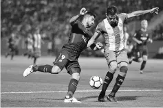  ??  ?? Barcelona’s forward from Uruguay Luis Suarez (L) vies with Giroma’s Colombian defender Bernardo Espinosa during the Spanish league football match Girona FC vs FC Barcelona at the Montilivi stadium in Girona on September 23, 2017. - AFP photo