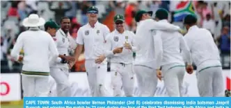  ??  ?? CAPE TOWN: South Africa bowler Vernon Philander (3rd R) celebrates dismissing India batsman Jasprit Bumrah and winning the match by 72 runs during day four of the First Test between South Africa and India in Cape Town, yesterday. —AFP