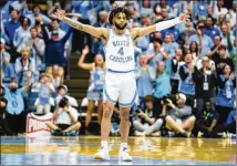  ?? JACOB KUPFERMAN/ASSOCIATED PRESS ?? North Carolina guard R.J. Davis exhorts the crowd during Saturday’s 62-57 loss to Duke in Chapel Hill, N.C. The Tar Heels (19-12) are on the bubble for an NCAA invitation.