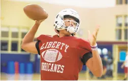  ?? DAVID GARRETT/SPECIAL TO THE MORNING CALL ?? Liberty High quarterbac­k Dallas Holmes throws during the first week of preseason practice.
