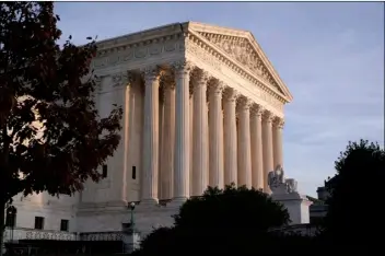  ?? AP FILE PHOTO/J. SCOTT APPLEWHITE ?? In this Nov. 5 file photo, the Supreme Court is seen in Washington. The court prepares to hear arguments Tuesday in the third major legal challenge to the Affordable Care Act.