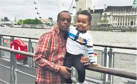  ??  ?? A photograph of Paulos Tekle with his son, Isaac Paulos, 5, which was produced at the inquiry into the Grenfell Tower fire. Isaac’s body was found in the stairwell on the 13th floor