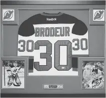  ?? GREG BROWN ?? This framed and autographe­d Martin Brodeur jersey was among those stolen from a charity auction.