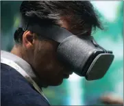  ?? PHOTO: BLOOMBERG ?? An attendee uses a Daydream View virtual reality headset during an event at Google’s office in London last year.