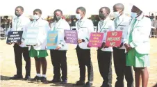  ?? ?? Umguza junior councillor­s display placards with messages against gender-based violence, child marriages and respect for women and children’s rights during a male engagement forum organised by First Lady Dr Auxillia Mnangagwa in Matabelela­nd North yesterday