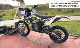  ??  ?? An off-road bike seized by Greater Manchester Police