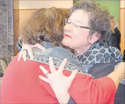  ?? LOUIS POWER/THE TELEGRAM ?? St. John’s Centre MHA Gerry Rogers embraces Tina Davies, founder of Richard’s Legacy Foundation for Survivors of Suicide Loss and a member of the Community Coalition 4 Mental Health. The release of the All-party Committee on Mental Health and...