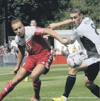  ??  ?? Lois Maynard, left, in action against Dover on the opening day of the season