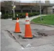  ?? JACK LAKEY/TORONTO STAR ?? Collapsed road at the bottom of Woodbine Ave. has caused floods.