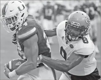  ?? File, Wilfredo Lee / The Associated Press ?? Georgia Tech’s Step Durham tries to bring down Miami’s Travis Homer as he runs for a touchdown during last week’s game. The Jackets are 2-1 in ACC play and will host Wake Forest today.