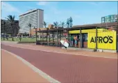  ??  ?? SPAZA STYLE: Afro’s, where surfers stop off for a snack. The bright yellow container is authentica­lly South African.