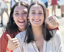  ?? PHOTO: PETER MCINTOSH ?? Great day out . . . Jennifer O’Connell ( 21, left) and Isabel Hulme (20) are feeling upbeat.