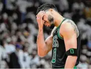  ?? Wilfredo Lee/Associated Press ?? Boston Celtics forward Jayson Tatum reacts during the second half of Game 3 of the NBA playoffs Eastern Conference finals against the Miami Heat Sunday in Miami.