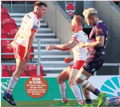  ??  ?? RYAN IS FLYIN’.. St Helens star Ryan Morgan (left) celebrates scoring the opening try for his team