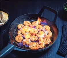  ?? Scott Suchman / For The Washington Post ?? Saffron Shrimp Flambe.