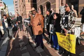  ?? Arnold Gold/Hearst Connecticu­t Media ?? Attorney Benjamin Crump, center, speaks at a news conference in front of City Hall in New Haven on Nov. 29, 2022 following the arrest of five New Haven Police officers in connection with injuries sustained by Richard “Randy” Cox while in police custody alongside Cox's mother, Doreen Coleman, behind Crump, and sisters LaToya Boomer, center, and LaQuavius LeGrant, far right.