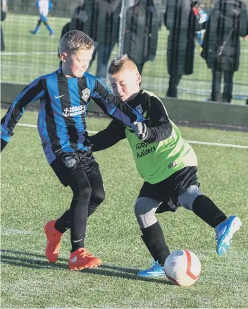  ??  ?? Russell Foster League action at Silksworth Sports Complex between Escomb FC (green) and Newcastle Boys Club (blue/black).