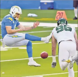  ?? AP ?? BLOCK PARTY: Chargers punter Ty Long has his punt blocked by Jets defensive lineman Henry Anderson last Sunday in Los Angeles. It was one of the rare big plays provided by the Jets’ special teams so far this season.
