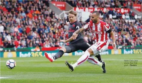  ?? — Reuters ?? Stoke City’s Jese scores their first goal.