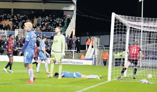  ?? Chelsie Wilson ?? Ryan Lloyd leaves Hartlepool floored after his 86th minute equaliser – and the Silkmen went on to score a winner at Victoria Park