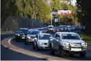  ??  ?? A traffic jam is seen ahead of a border checkpoint in Albury on Wednesday. Photograph: Lukas Coch/EPA