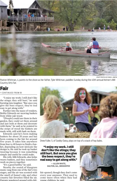  ?? STAFF PHOTOS BY ERIN O. SMITH ?? Paxton Whitman, 4, points to the shore as her father, Tyler Whitman, paddles Sunday during the 40th annual Ketner’s Mill Country Arts Fair. Drew Fuller, 5, of Soddy-Daisy, plays on top of a stack of hay bales. Jeff Clawson, of the Choo Choo Forge, uses...