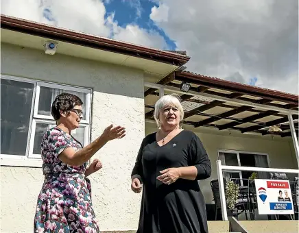  ?? BRADEN FASTIER/STUFF ?? RE/MAX Elite Nelson owner Kate Bradley, right, and RE/MAX listing agent Janice Emery look at a property in Nelson that is coming onto the market. Real estate agents in Nelson, Richmond and Motueka say competitio­n in the $500,000 price range is fierce.