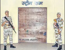  ?? PTI FILE ?? Indo Tibetan Border Police troopers guard a strong room where EVMS of Madhya Pradesh assembly polls are kept in Jabalpur.