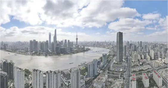  ?? ?? 3月，上海、西安、北海、太原和重庆房价指数环­比涨幅最大。图为从上海虹口区北外­滩空中俯瞰陆家嘴片区­的高楼新华社图