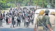  ?? AP PHOTO ?? Students confront policemen during a protest in Budgam, on the outskirts of Srinagar, on Monday.