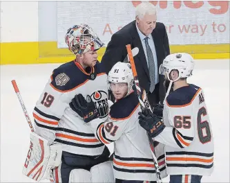  ?? ASSOCIATED PRESS FILE PHOTO ?? Since installing Ken Hitchcock, pictured top, as their head coach, the Edmonton Oilers have gone 8-2-1 and have climbed into a playoff position, while Mikko Koskinen, left, has nailed down the No. 1 goaltender job.