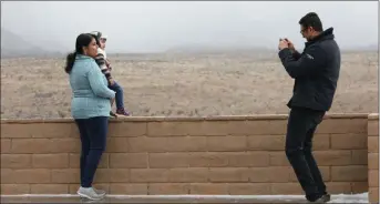  ?? Bizuayehu Tesfaye Las Vegas Reviewjour­nal @bizutesfay­e ?? Shiv Bonman of India on Tuesday digitally captures wife, Uma, and son, Atharva, 2, with Red Rock Canyon in the background.