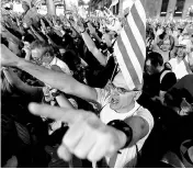  ??  ?? People celebrate in Sant Jaume square after the Catalan regional parliament declared independen­ce from Spain