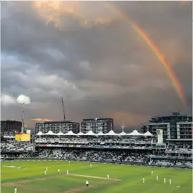  ??  ?? After the storm: A rainbow frames the scene yesterday at Lord’s