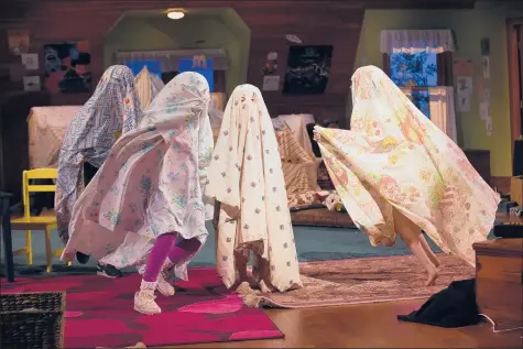  ?? CLOE POISSON | CPOISSON@COURANT.COM ?? CHILDREN dance around dressed as ghosts at a dress rehearsal for “Make Believe,” the season-opening play at Hartford Stage. Below, the young Kate, played by Sloane Wolfe, and Megan Byrne as the adult Kate share a smoke.