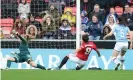 ??  ?? Jess Sigsworth slides home Manchester United’s second goal against City. Photograph: Magi Haroun/Rex/Shuttersto­ck