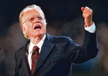  ?? JOHN D. SIMMONS / CHARLOTTE OBSERVER / TNS ?? Billy Graham preaches during a 1996 crusade in his hometown of Charlotte, N.C., the last of four there. From the first one, in 1947, to the last, the evenings would build toward Graham’s altar call.