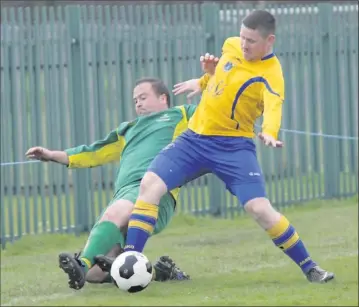  ??  ?? Wicklow Town’s Jonathan Byrne manages to keep the ball in play during the Wicklow Cup clash.