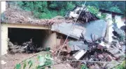  ?? PTI ?? Damaged houses after a cloudburst hit Singhali area near Pithoragar­h in Uttarakhan­d on Friday