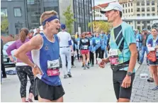  ?? MICHAEL SEARS / MILWAUKEE JOURNAL SENTINEL ?? PNC Marathon winner Tyler Sigl of Seymour (right) compares notes with second-place finisher David Luy of Brookfield. Unofficial times were 2:20 for Sigl and 2:23 for Luy.