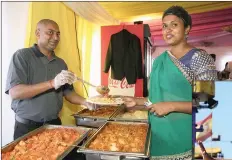  ??  ?? LEFT: Nishal Ramdu and Keshni Govender serving some of the tasty food on offer at Indian Delights on-site restaurant.