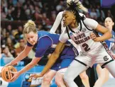  ?? NELL REDMOND/AP
WOMEN’S NCAA TOURNAMENT ?? Presbyteri­an guard Christina Kline, left, keeps the ball from South Carolina forward Ashlyn Watkins during Friday’s matchup in Columbia, S.C.