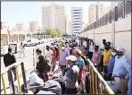  ?? Photos by Mohammad Morsi ?? Top and above: Thousands of residence violators throng the reception center as many have to undergo
medical tests.