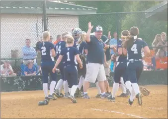  ?? STAFF PHOTO BY ANDY STATES ?? La Plata’s softball team celebrates after sealing its 3-2, eight-inning win over the Eastern Tech Mavericks in the 2A state semifinals at Bachman Sports Complex in Glen Burnie on Wednesday afternoon.