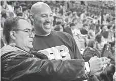  ?? RICHARD MACKSON, USA TODAY SPORTS ?? LaVar Ball, taking a selfie with Robert Pacheco, left, has not shied away from the spotlight as he promotes his sons.