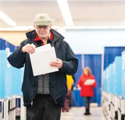  ?? PAT NABONG/SUN-TIMES FILE ?? Voters take part in Chicago’s first day of early voting Feb. 15 at the city’s downtown supersite, 191 N. Clark St.